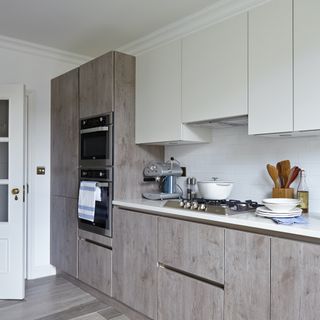 Grey wood clad kitchen cabinets