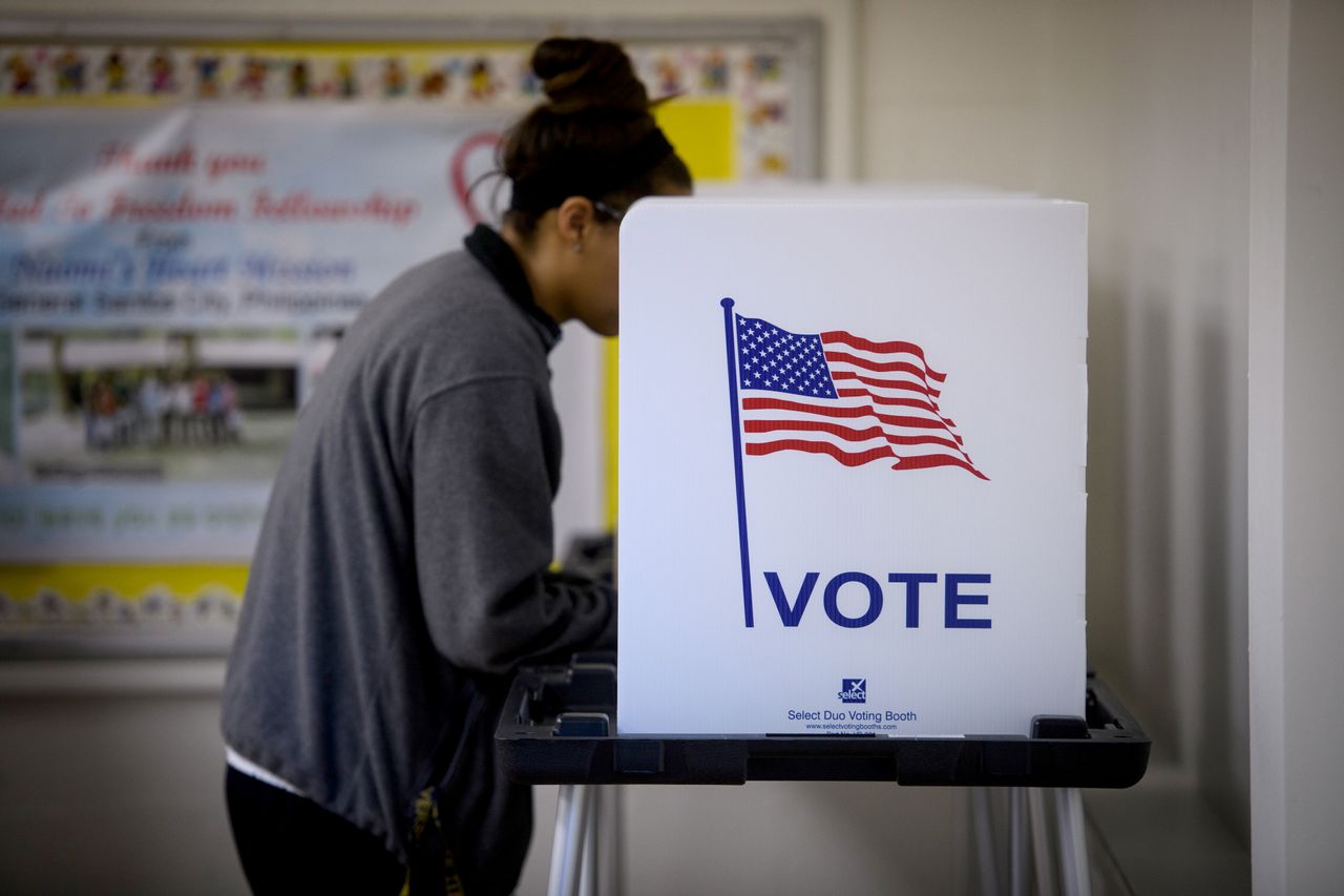 A woman voting.