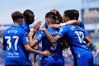 Getafe players celebrate a goal against Mallorca in May 2024.