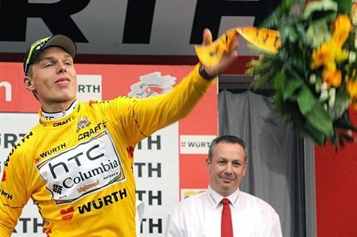 Tony Martin (HTC-Columbia) tosses his bouquet on the podium of stage 5 of the Tour de Suisse.