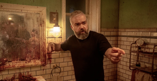 David F. Sandberg on the set of Until Dawn, pointing at something off screen.