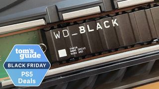 WD_Black SN850 SSD in a PS5 console with a Tom's Guide Black Friday deal tag