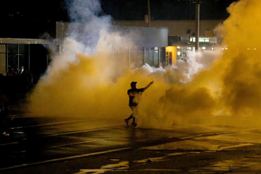 One shot, others arrested as Ferguson protests slip back into chaos