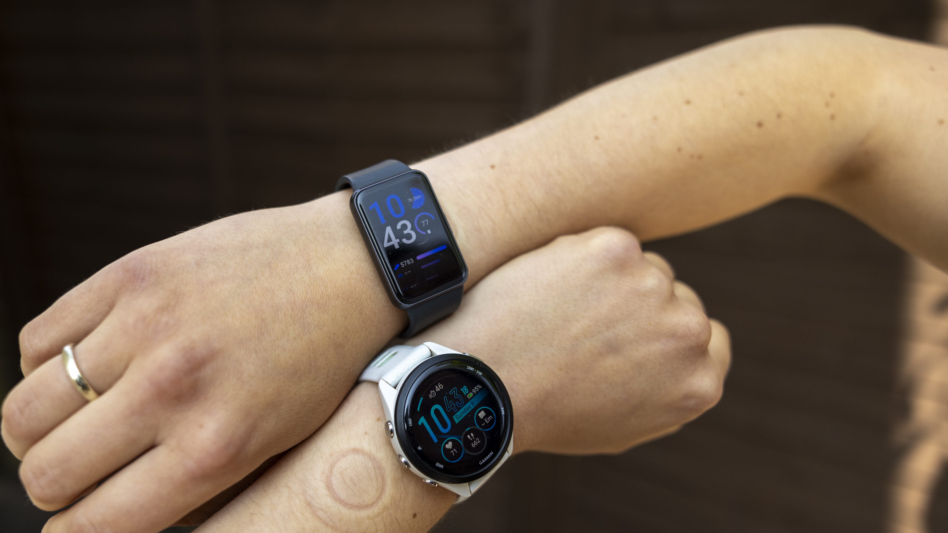 The Samsung Galaxy Fit 3 watch in grey worn on a female wrist