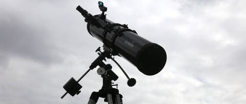 Sky-Watcher telescope set against a cloudy sky