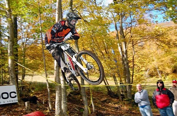 A rider pulls a move off a jump.