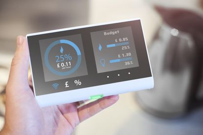 Hand holding a smart energy meter