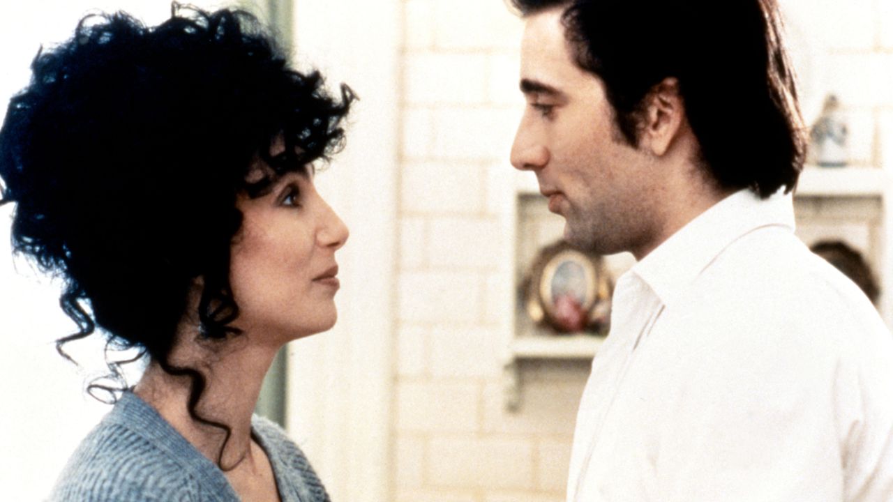 cher smiles at nic cage in the bakery kitchen in moonstruck