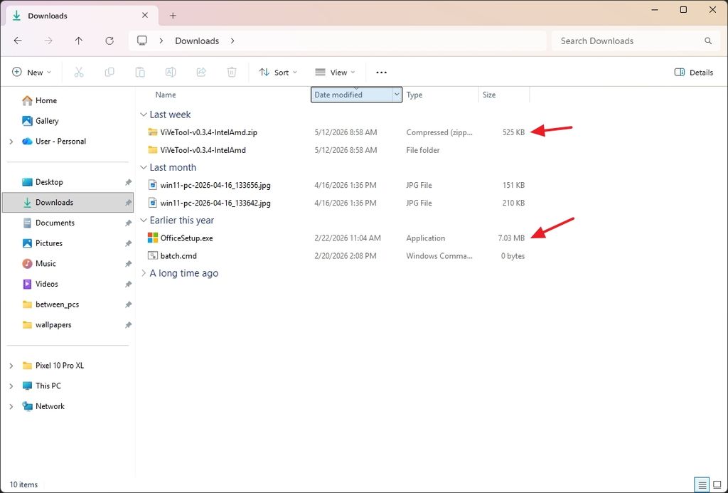 File Explorer window showing a Downloads folder with items sorted by date. Two files are highlighted with red arrows, showing size details.