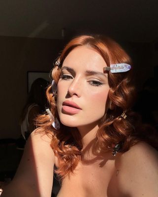 Bella Thorne wearing her copper hair pinned back