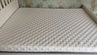 The Levitex Gravity Defying Mattress photographed on a white wooden bed frame in our reviewer's house