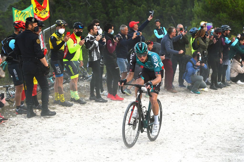 ALTO DE LAS ANTENAS DEL MAIGMO TIBI ALICANTE SPAIN FEBRUARY 04 Aleksander Vlasov of Russia and Teamm Bora Hansgrohe attacks in the final gravel strokes sector while fans cheer during the 73rd Volta A La Comunitat Valenciana 2022 Stage 3 a 1551km stage from Alicante to Alto De Las Antenas Del Maigmo Tibi 1080m VCV2022 on February 04 2022 in Alicante Spain Photo by Dario BelingheriGetty Images