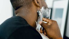 A man shaving his stubble