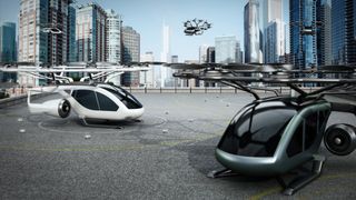 A conceptual image of flying cars taking off and parking on a helipad among skyscrapers.