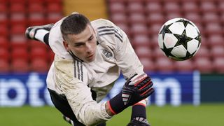 Andriy Lunin player of Real Madrid dives for the ball in training for the UEFA Champions League 2024/25 match Liverpool vs Real Madrid on November 27, 2024