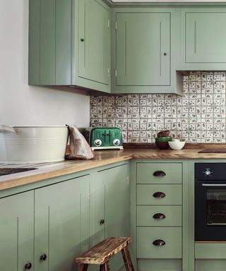 mint green kitchen scheme with patterned tiles