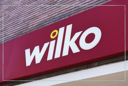 A close up of a Wilko sign above a store