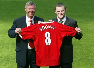 Rooney with Sir Alex Ferguson at a press conference confirming his arrival at Manchester United (Gareth Copley