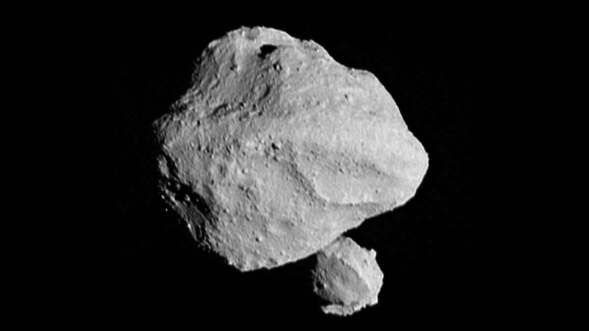 Curious double moon discovered orbiting asteroid 'Dinky' now has a name - Space.com image