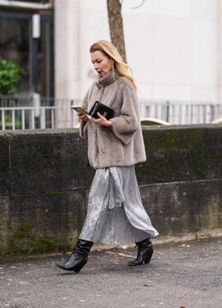 French street style - woman with a clutch bag