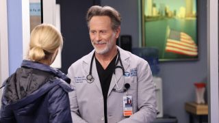 Dean Archer smiling at Hannah Asher in Chicago Med Season 8
