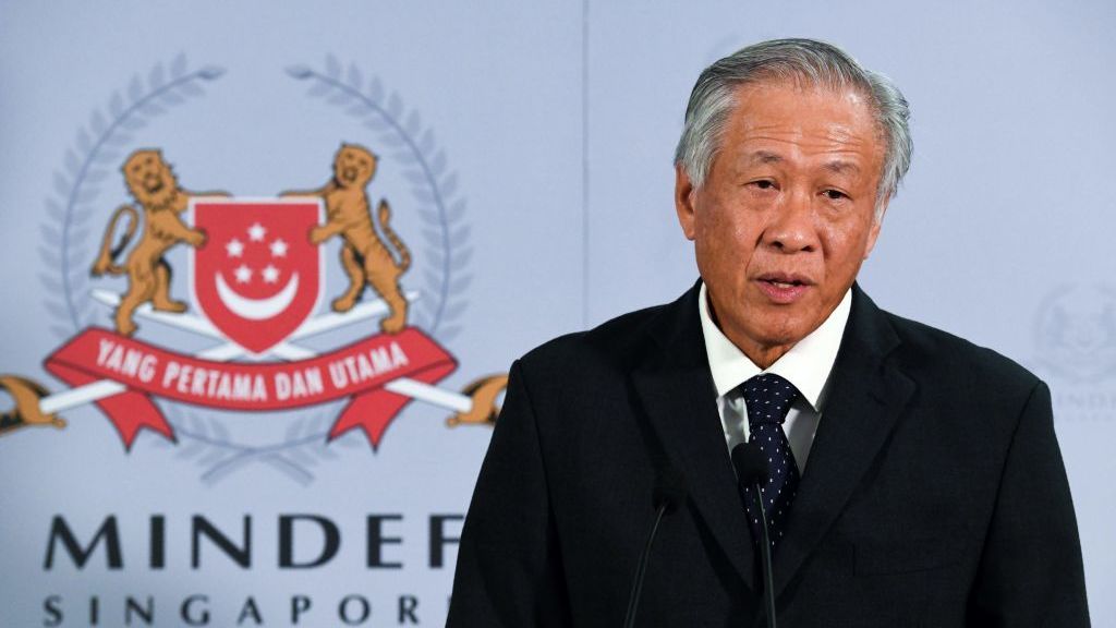 Singapore&amp;#039;s Defence Minister Ng Eng Hen speaking in front of a sign