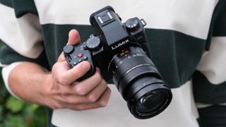 Panasonic Lumix G9 II camera in a hand