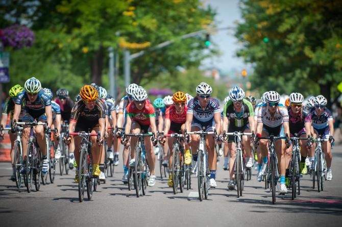 The field keeping close tabs on the action just off the front as they race through Old Town Fort Collins.