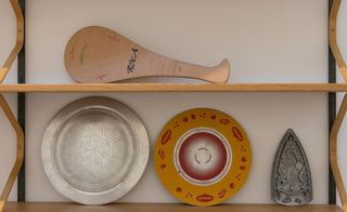 Plates on a wooden shelf