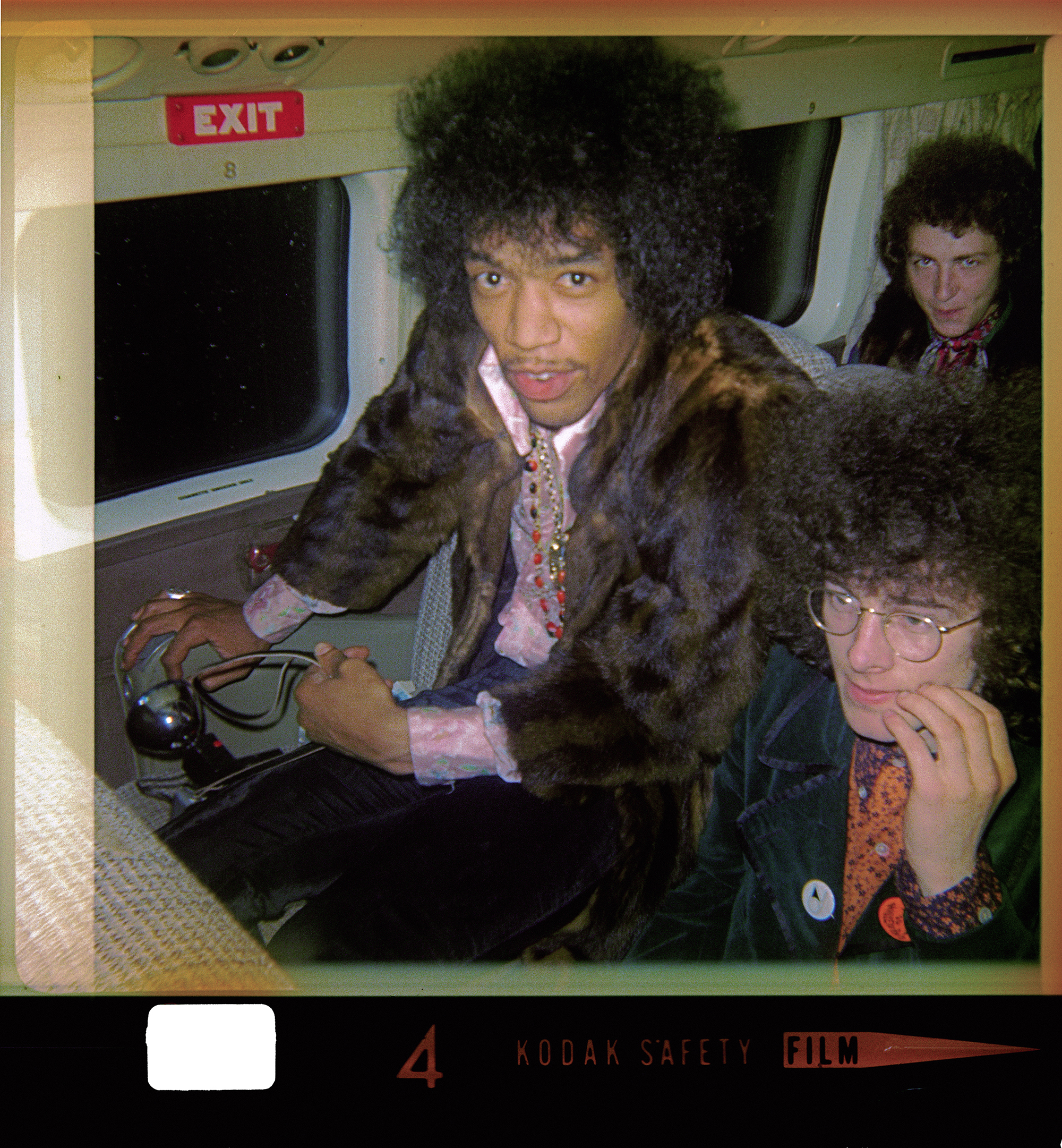 Jimi Hendrix (with Experience bassist Noel Redding, right, and drummer Mitch Mitchell, back) on the bus during their tour opening for the Monkees in 1967.