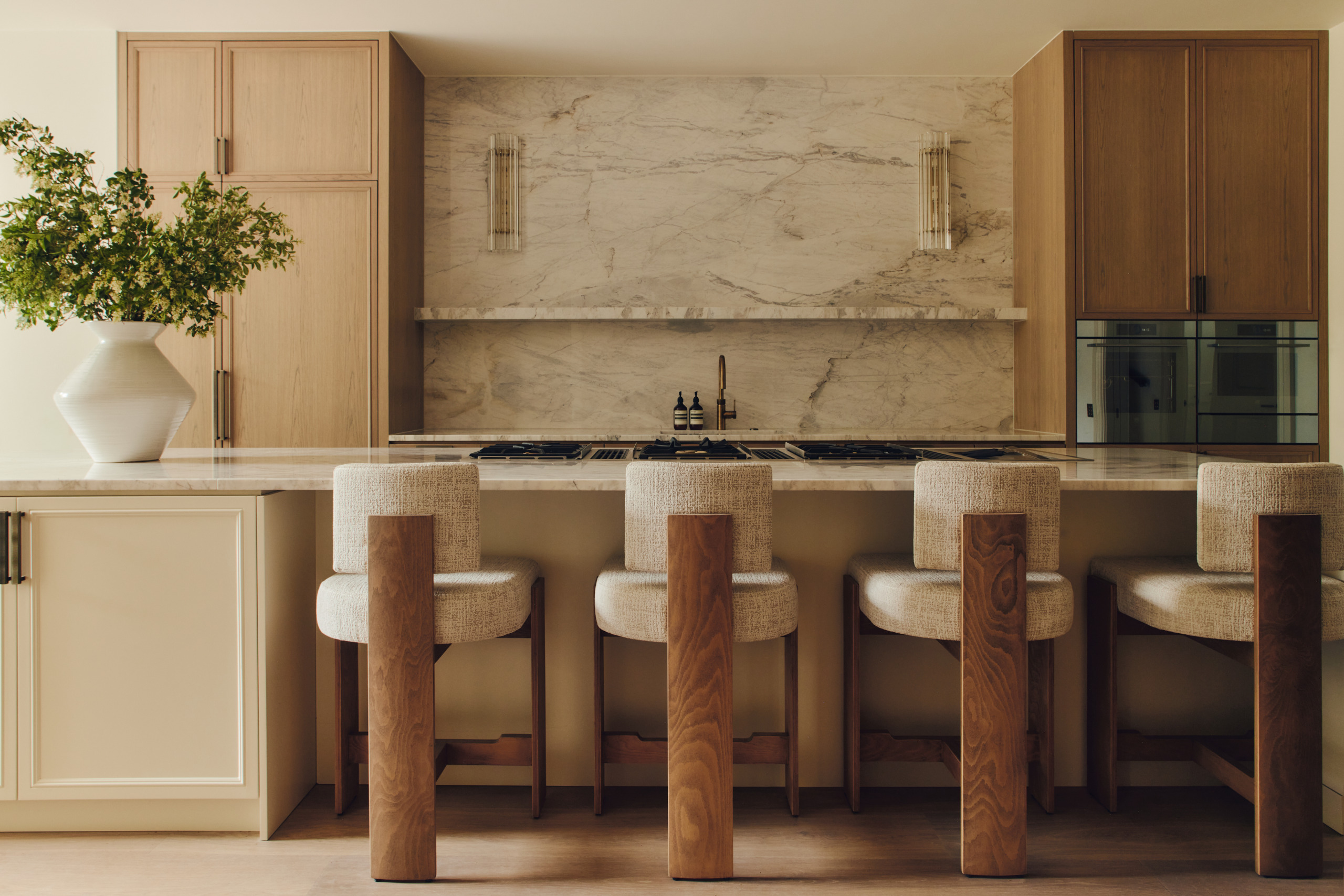 kitchen with central island and marble splashback