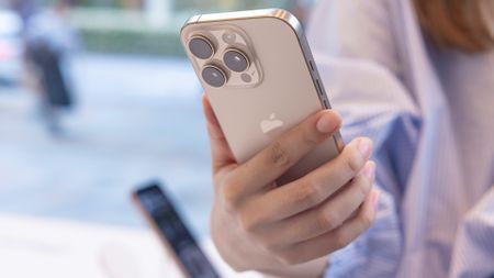 Woman holding an iPhone 