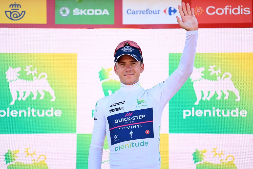 TOMARES SPAIN SEPTEMBER 06 Remco Evenepoel of Belgium and Team QuickStep Alpha Vinyl celebrates at podium as White Best Young Rider Jersey winner during the 77th Tour of Spain 2022 Stage 16 a 1894km stage from Sanlcar de Barrameda to Tomares LaVuelta22 WorldTour on September 06 2022 in Tomares Spain Photo by Justin SetterfieldGetty Images