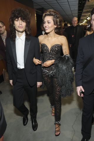 Maxx Morando and Miley Cyrus at The 66th Annual Grammy Awards, airing live from Crypto.com Arena in Los Angeles, California, Sunday, Feb. 4.