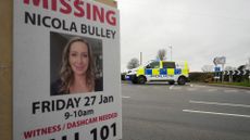A police car next to a missing poster of Nicola Bulley near the River Wyre, 17 February 2023