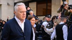 Huw Edwards leaves Westminster Magistrates' Court after receiving a six-month jail sentence, suspended for two years, for accessing indecent images of children