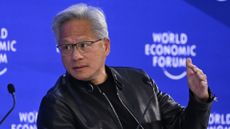 Nvidia CEO Jensen Huang pictured in conversation with BlackRock CEO Larry Fink at the 2026 World Economic Forum (WEF) in Davos while wearing a black leather jacket.