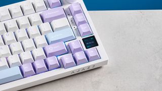 A white and purple Epomaker Ajazz AK820 Pro mechanical keyboard