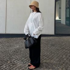 @deborabrosa wears red flip-flops from Ancient Greek Sandals