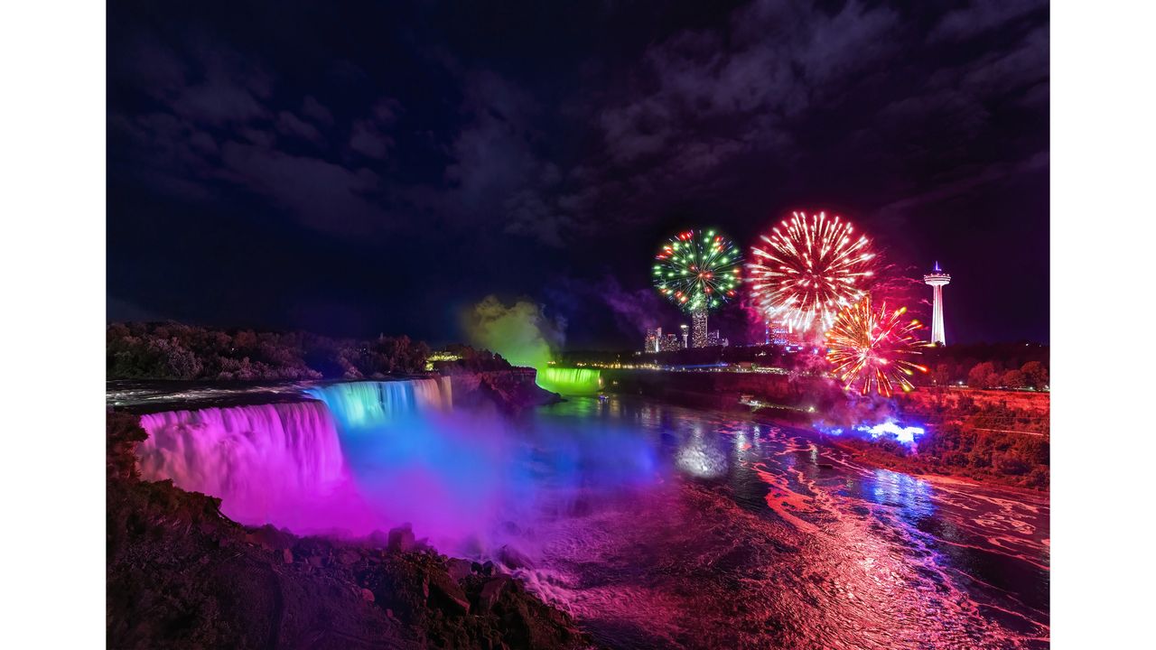 Niagara Falls illuminated at night with&nbsp;a fireworks display