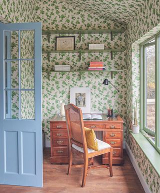 Home office with green floral wallpaper