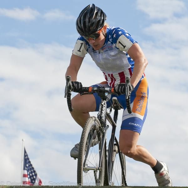Compton, who happens to love wearing the red, white and blue jersey and her team colors of white, blue and orange, as she remounts her bike and exits the flyover