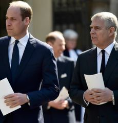 Prince William and Prince Andrew wearing suits holding programs at a church service