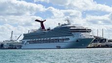 The cruise ship "Carnival Sunrise" part of the Carnival Cruise Line, is seen moored at a quay in the port of Miami, Florida, on December 23, 2020, amid the Coronavirus pandemic.
