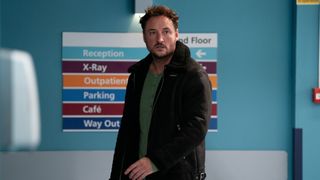 Martin looking worried as he rushes down a hospital ward in EastEnders