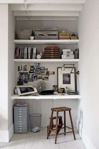 Office built into the alcove of a rustic white living room