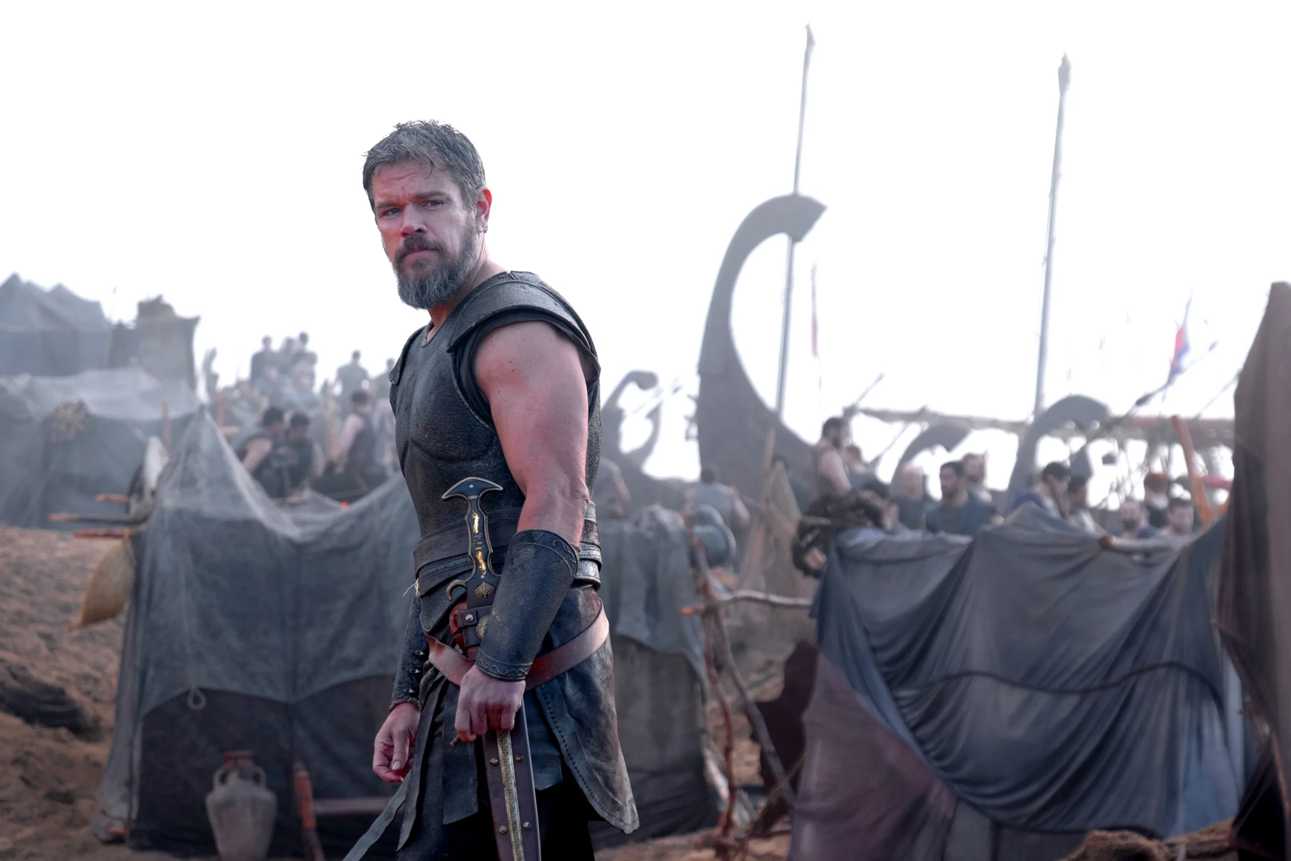 matt damon as odysseus leading an army on a beach shore in the odyssey