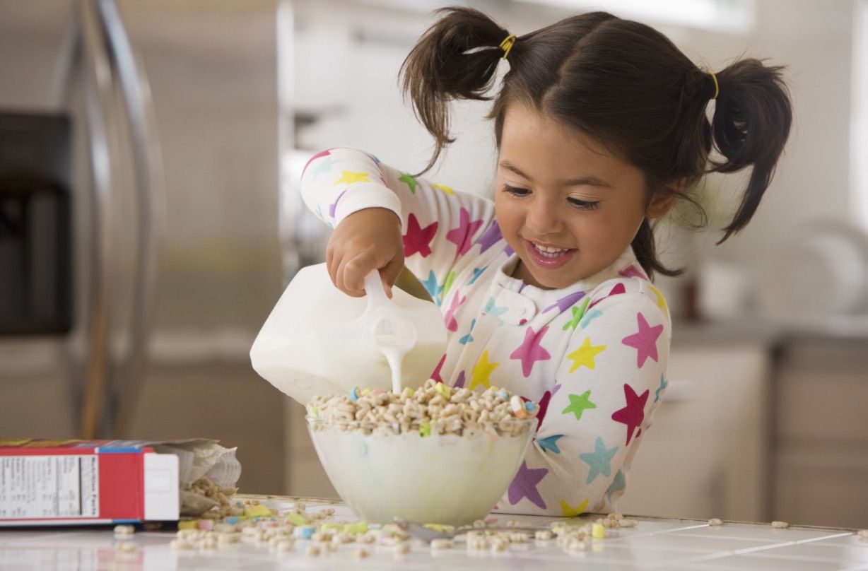 Girl making cereal