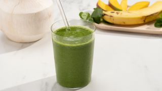 Bonberi Green Smoothie served in a glass with a straw
