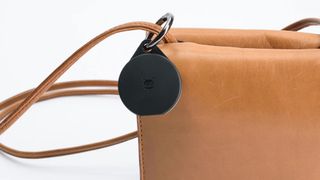 A Pebblebee Clip track attached to a handbag